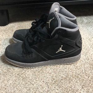 woman’s black Jordan’s
